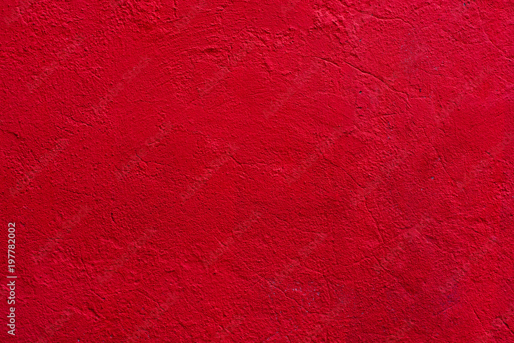 Obraz premium Background of a red stucco coated and painted exterior, rough cast of cement and concrete wall texture, decorative coating