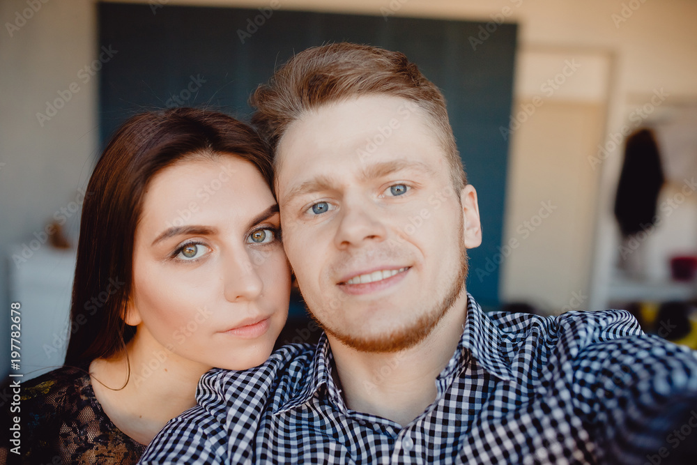 Young couple doing selfie photo on camera Young couple doing selfie photo on camera