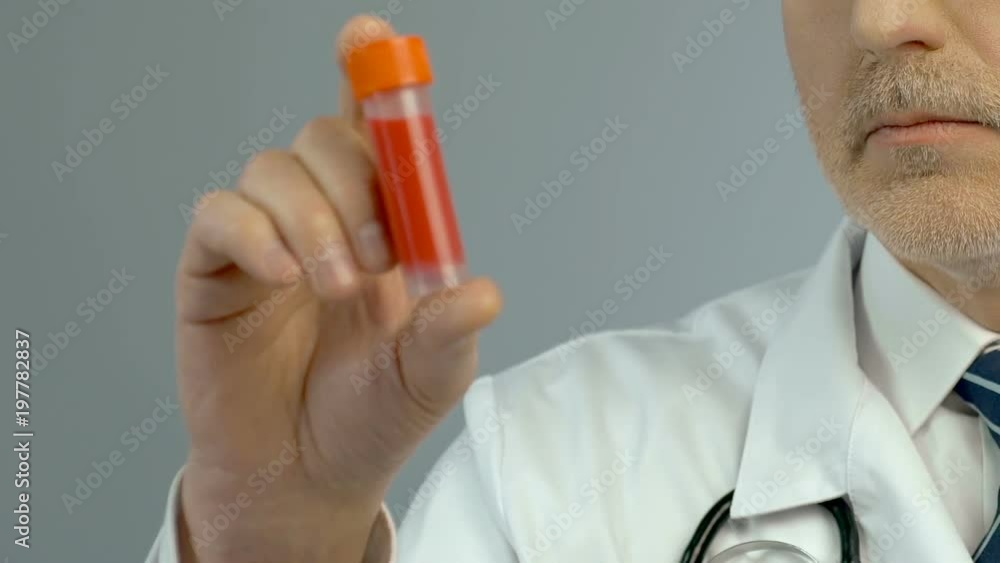 Scientist holds vaccine in hand, medical research, new drug development closeup Scientist holds vaccine in hand, medical research, new drug development closeup