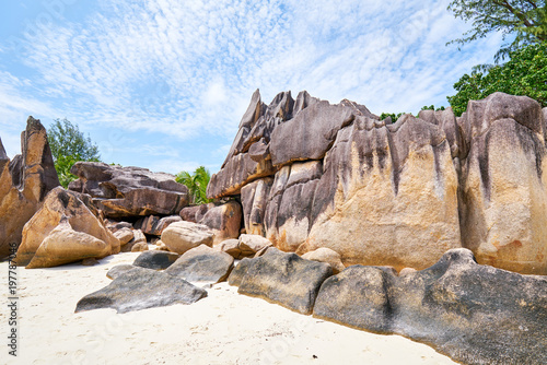 Laraie Bay's beach with granite rocks near giant tortoise farm, photo