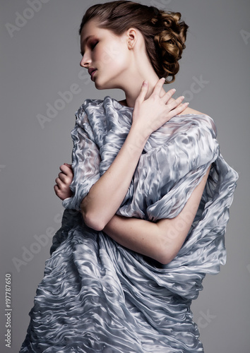 Obraz na płótnie Beautiful fashion model wearing blue silk dress