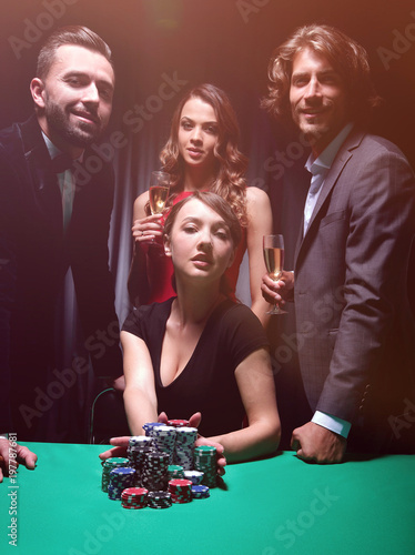 Woman doing all-in playing poker photo