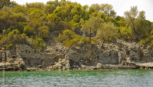 Seashore ruins on St. Nicholas island - Gemiler island, Turkey photo