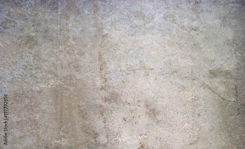 Concrete wall background. The background is interesting with texture, toned patches, natural cracks.