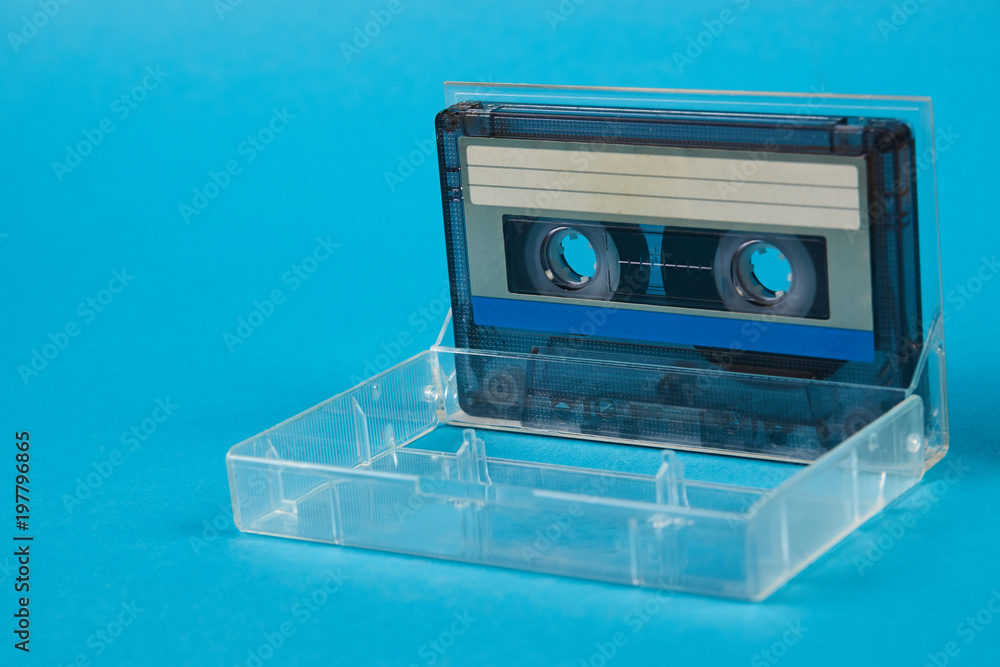 Blank cassette tape box on blue background. Vintage cassette tape case with  retro cassette mockup. Plastic analog magnetic clear packaging template.  Mixtape box open Photos | Adobe Stock