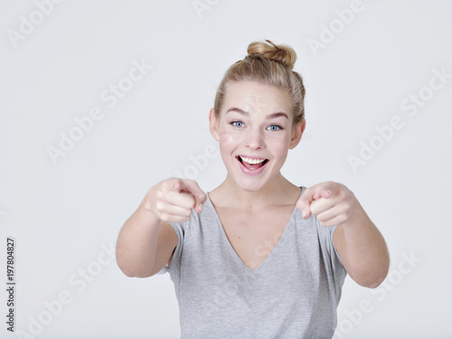 Wallpaper Mural Portrait of a cheerful  woman points to somebody Torontodigital.ca