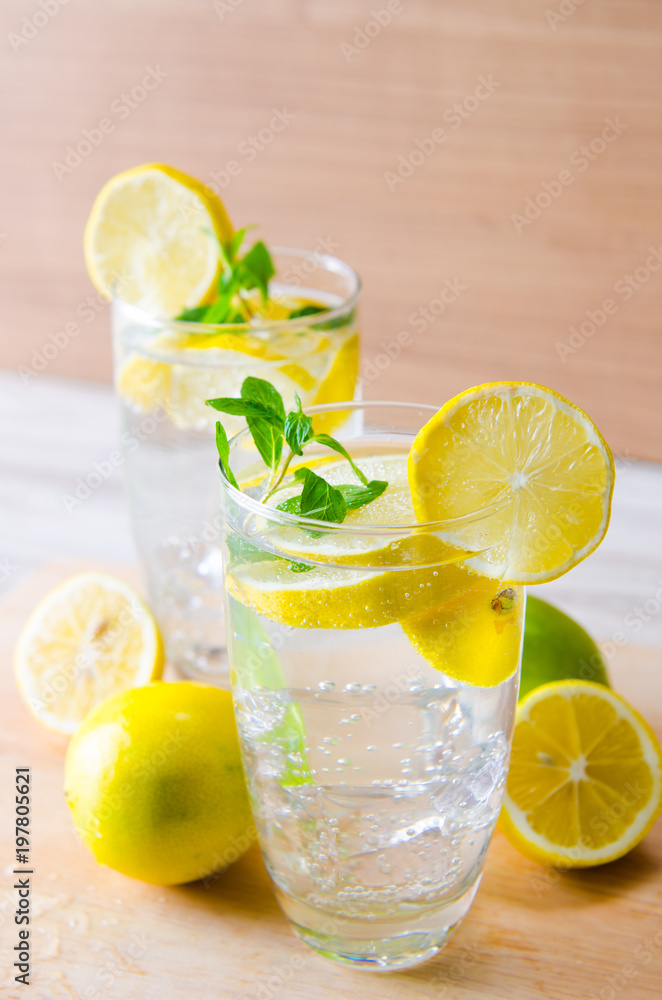 Glasss of mojito with lemon and drinking straw Glasss of mojito with lemon and drinking straw