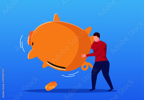 Businessman shaking an empty piggy bank