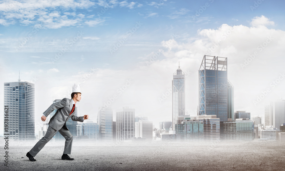 King businessman in elegant suit running and business center at background