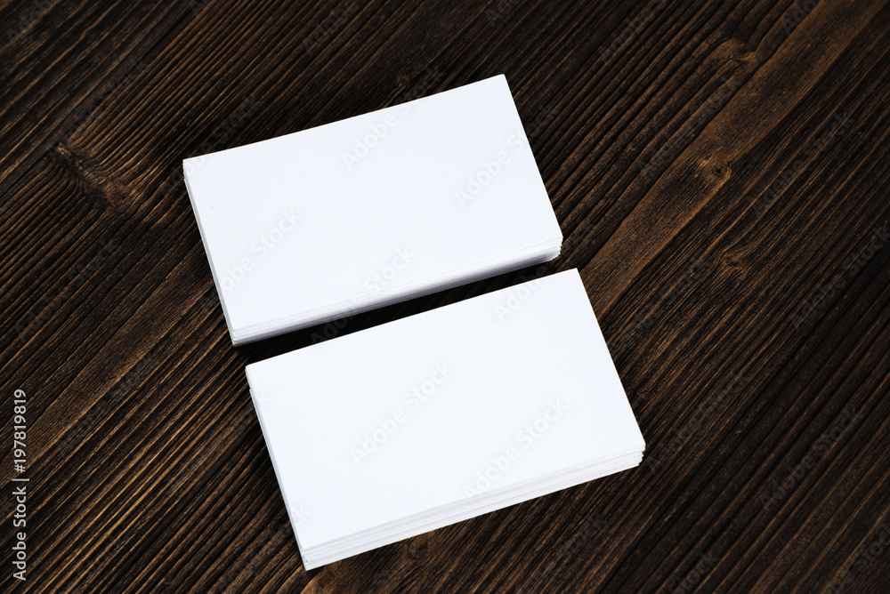 Blank business cards on wooden working table with copy space for add text ID. and logo, business company concept. Blank business cards on wooden working table with copy space for add text ID. and logo, business company concept.