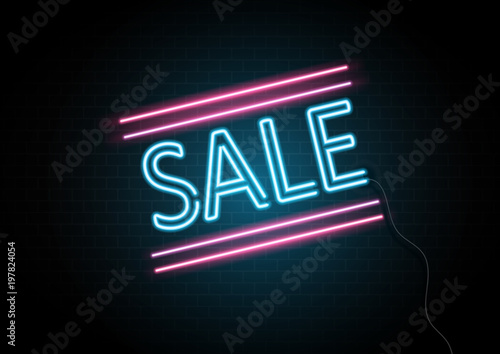 Neon sale sign on brick wall