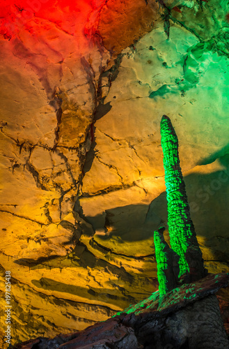 beautiful illuminated multicolored stalactites from karst Reed Flute cave. Guilin Guangxi  China photo