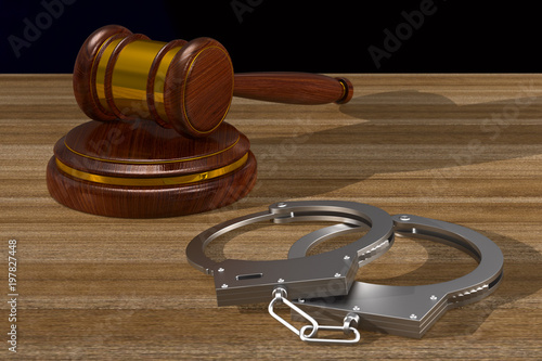 wooden gavel and handcuffs ...