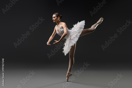 Fototapeta Naklejka Na Ścianę i Meble -  Beautiful ballerina in white tutu dancing view