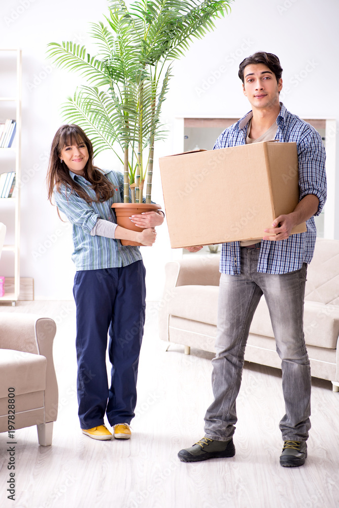 Young family moving in to new apartment after paying off mortgag Young family moving in to new apartment after paying off mortgag