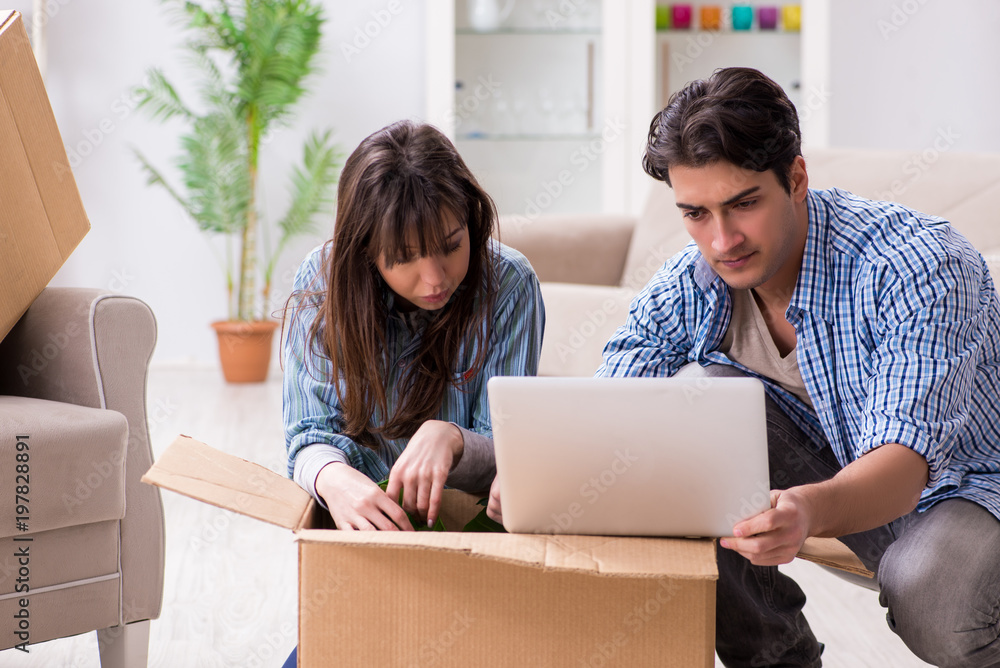 Young family moving in to new apartment after paying off mortgage Young family moving in to new apartment after paying off mortgage