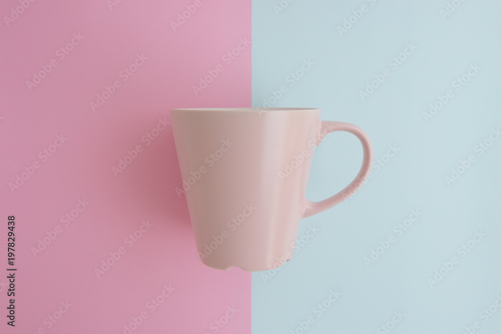 Minimal flat lay concept of pink coffee cup on the colorful background with copy space Minimal flat lay concept of pink coffee cup on the colorful background with copy space
