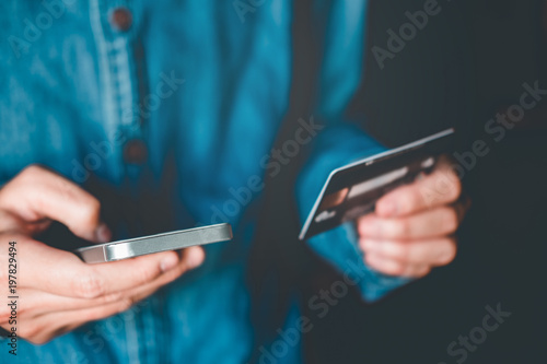 Online banking businessman using smartphone with credit card Fintech and Blockchain concept photo