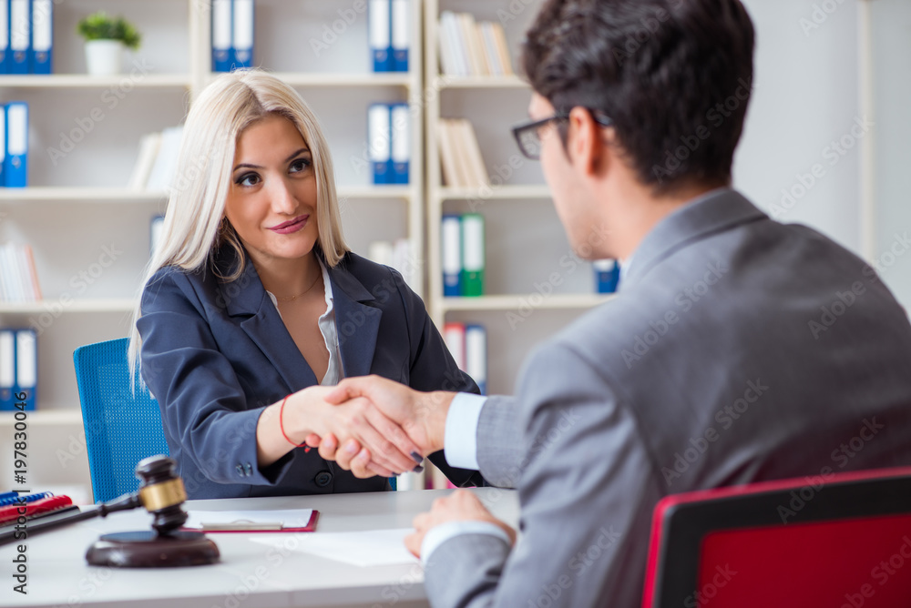 Lawyer discussing legal case with client Lawyer discussing legal case with client
