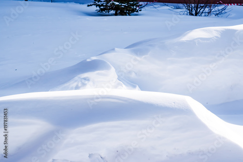     Natural winter snow surface texture with natural patterns, abstract winter background 
