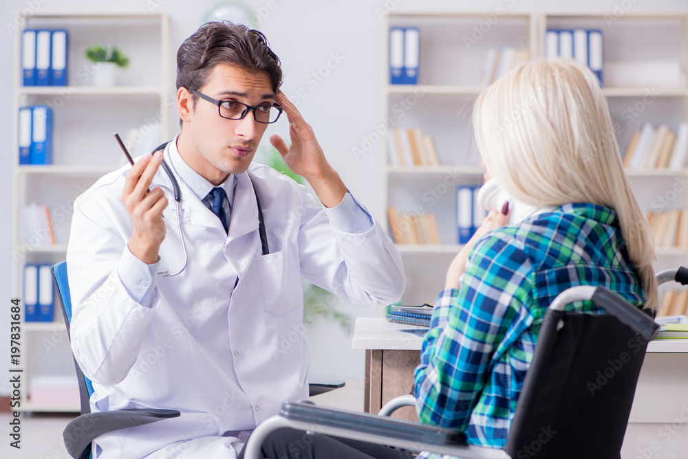 Obraz premium Disabled woman in wheel chair visiting man doctor