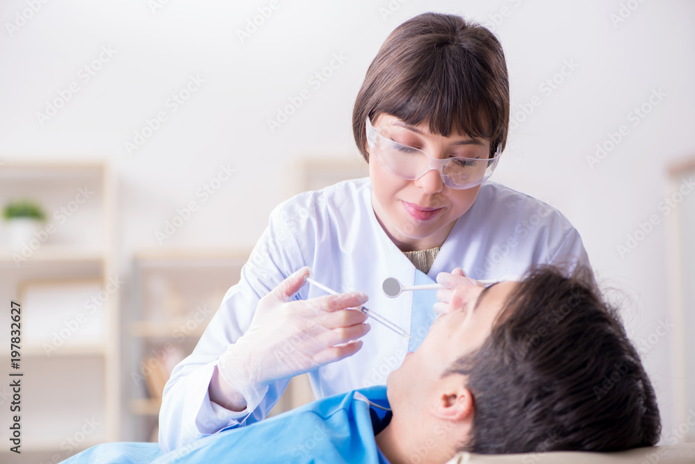 Patient visiting dentist for regular check-up and filling Patient visiting dentist for regular check-up and filling