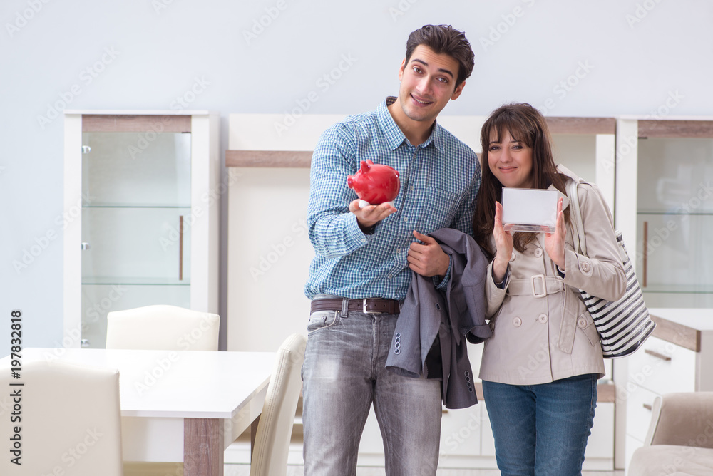 Young couple saving money for new furniture Young couple saving money for new furniture