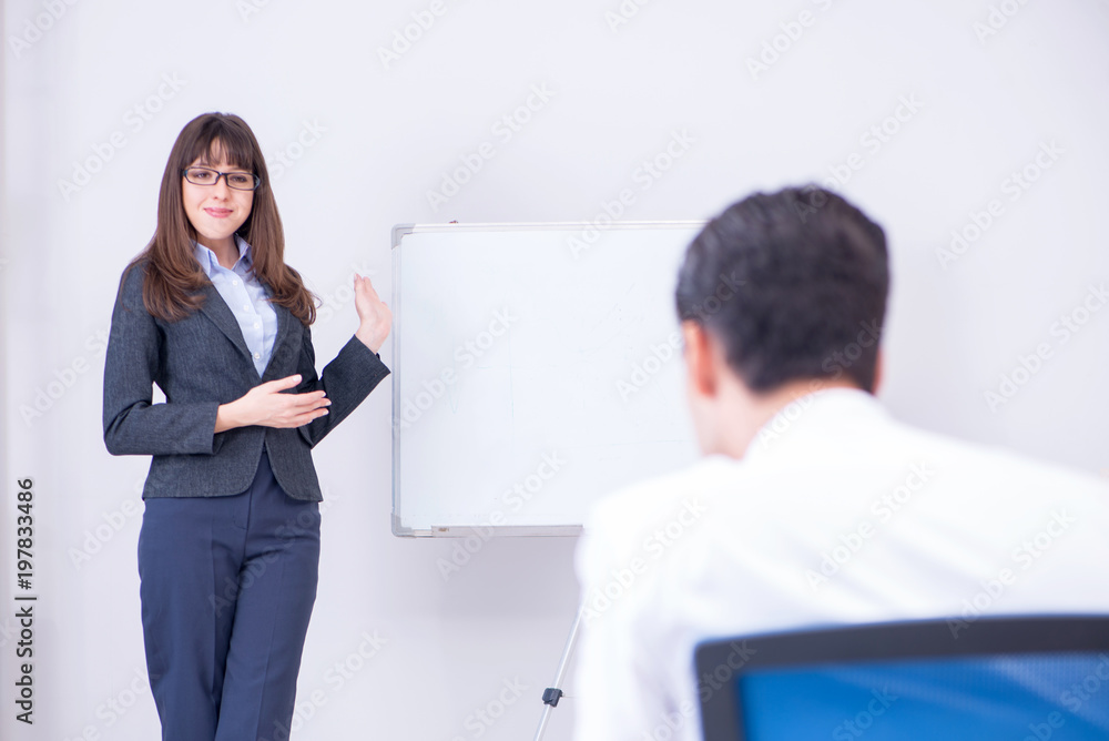 Business presentation in the office with man and woman Business presentation in the office with man and woman