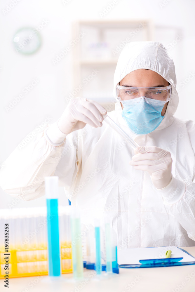 Young chemist student working in lab on chemicals Young chemist student working in lab on chemicals