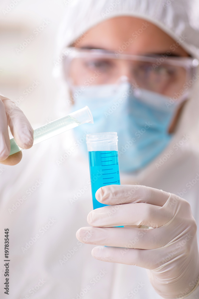 Young chemist student working in lab on chemicals Young chemist student working in lab on chemicals