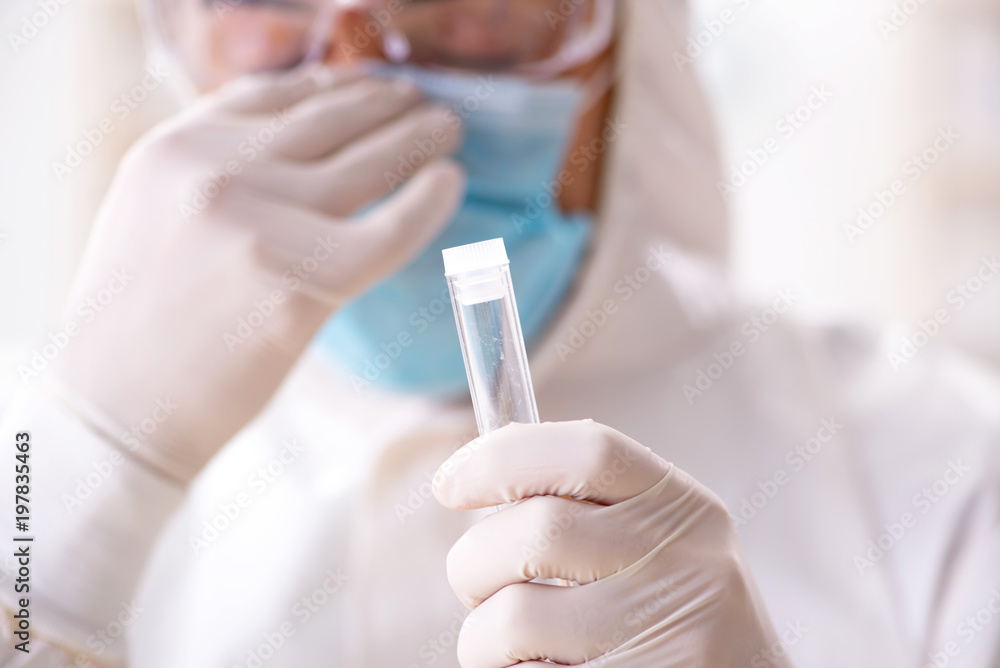 Young chemist student working in lab on chemicals Young chemist student working in lab on chemicals
