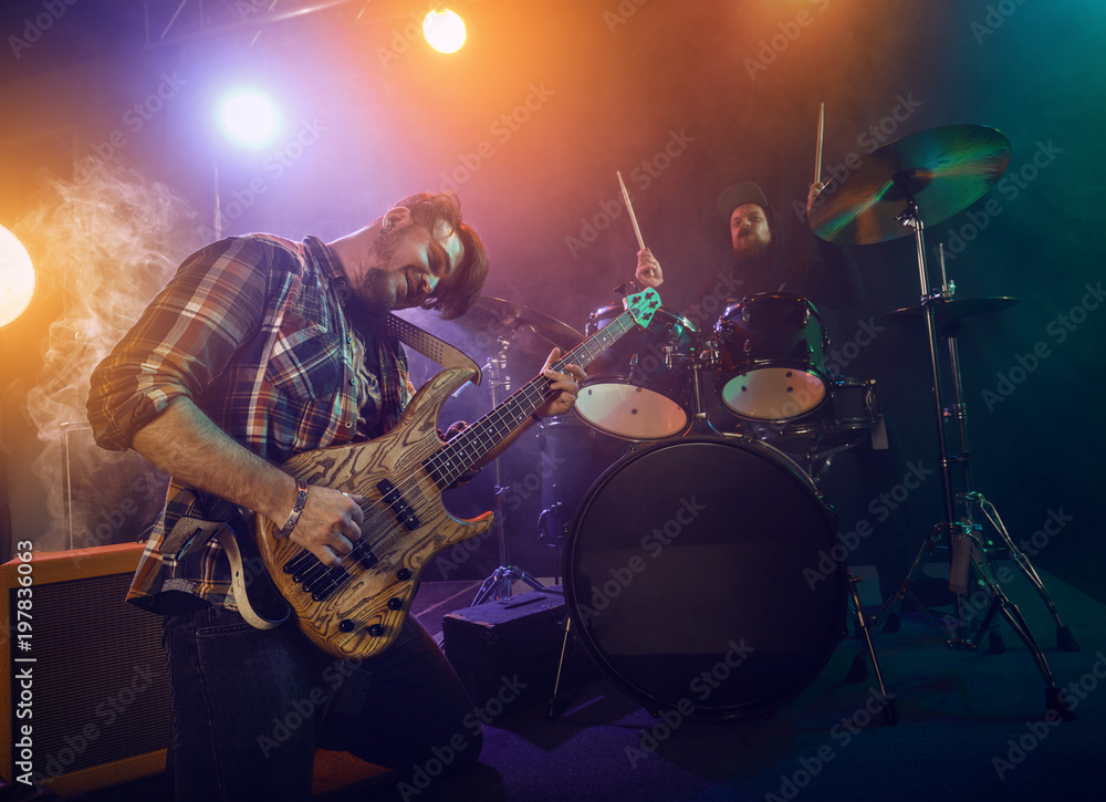 Obraz premium Bass Guitarist plays solo.