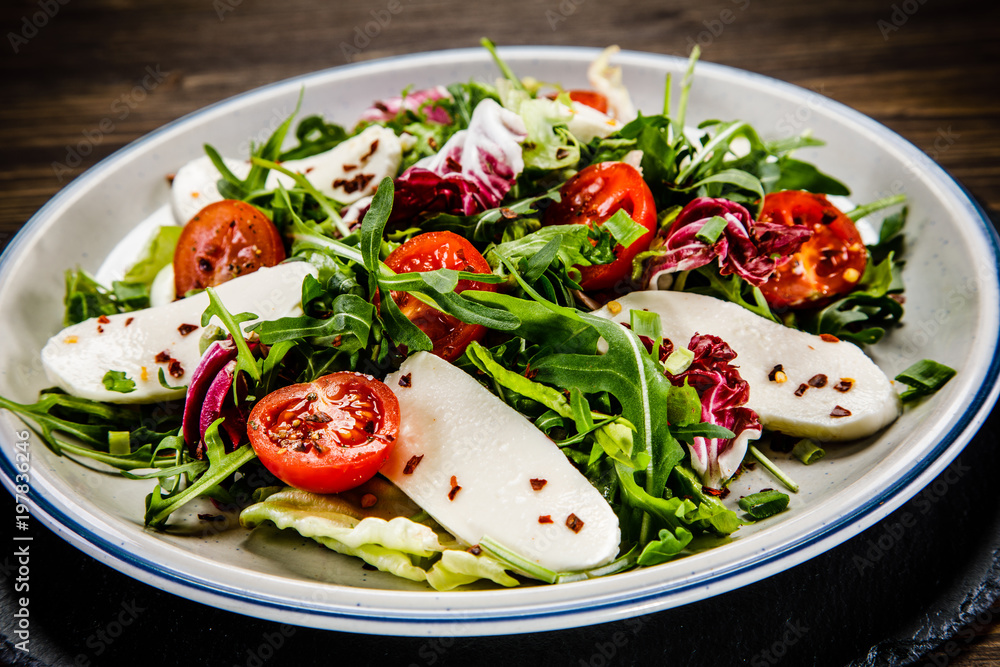 Greek salad on wooden background