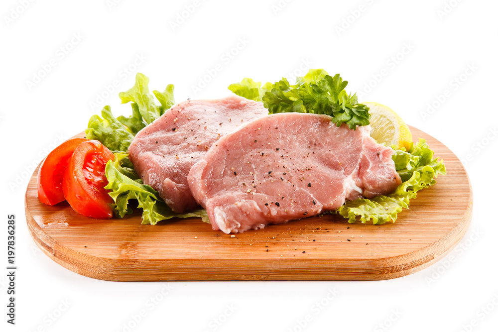 Fresh raw pork on cutting board on white background Fresh raw pork on cutting board on white background