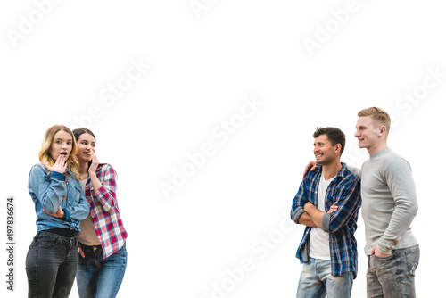 The four people flirt on the white wall background