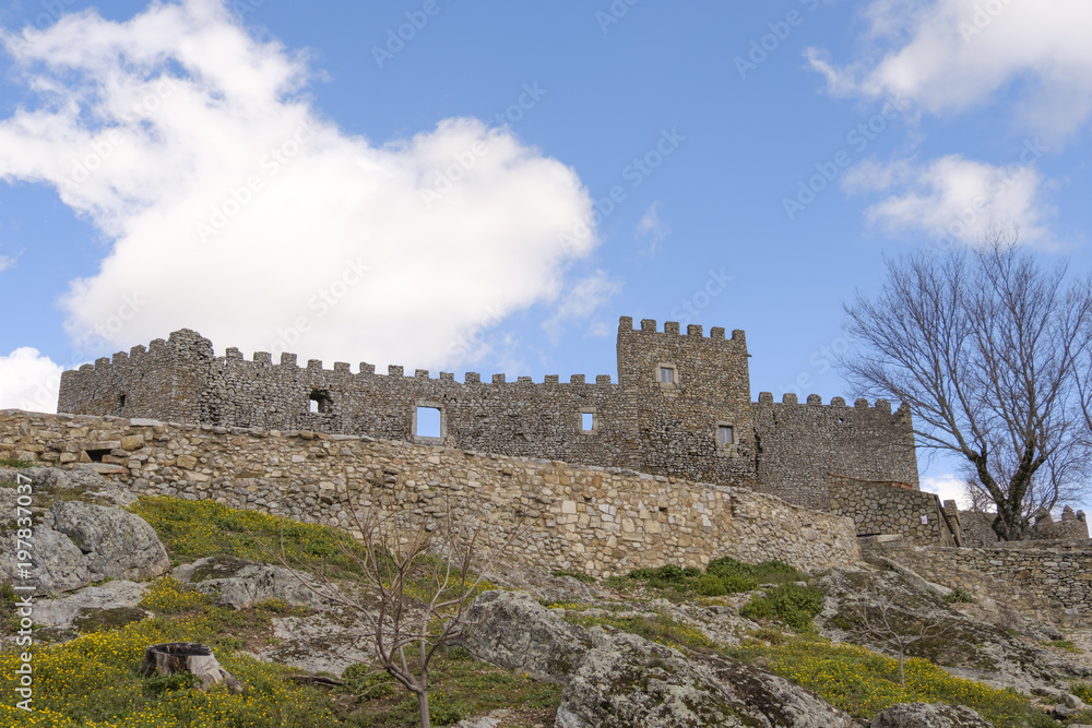 The ancient castle of montanchez, extremadura, spain, freely accessible to tourists, is situated on top of a mountain and offers a beautiful panoramic view of the landscape.