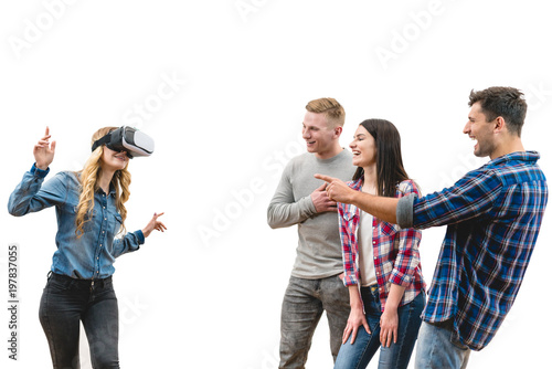 The four friends play with virtual reality glasses on the white background