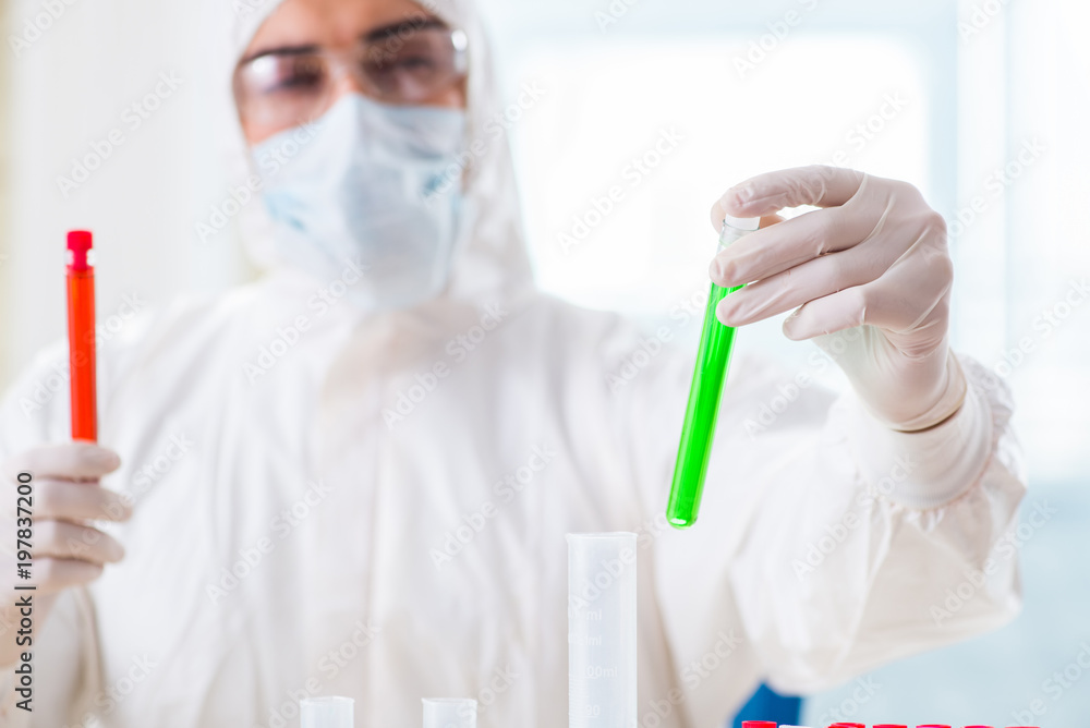 Young chemist student working in lab on chemicals Young chemist student working in lab on chemicals