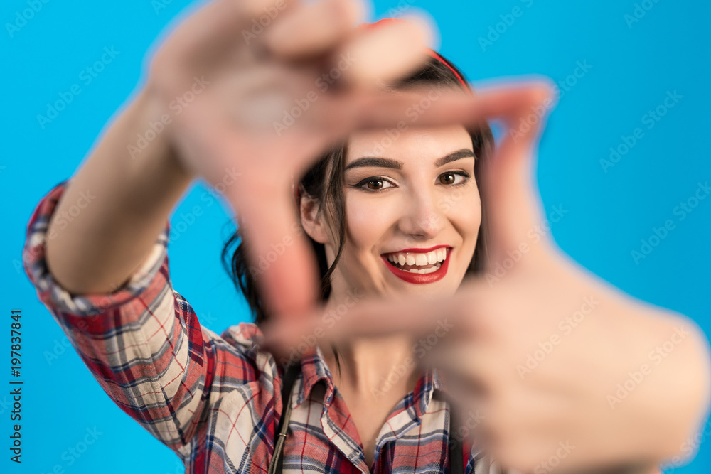 Obraz premium The cute woman gesturing on the blue background