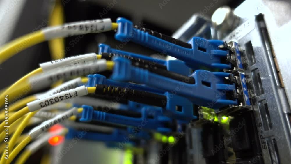 MOSCOW, RUSSIA - March 23: Optical server. Commutator. flashing lights. Optical fiber. Severs computer in a rack at the large data center. Close up. on March 23, 2018 in Moscow, Russia. Editorial MOSCOW, RUSSIA - March 23: Optical server. Commutator. flashing lights. Optical fiber. Severs computer in a rack at the large data center. Close up. on March 23, 2018 in Moscow, Russia. Editorial