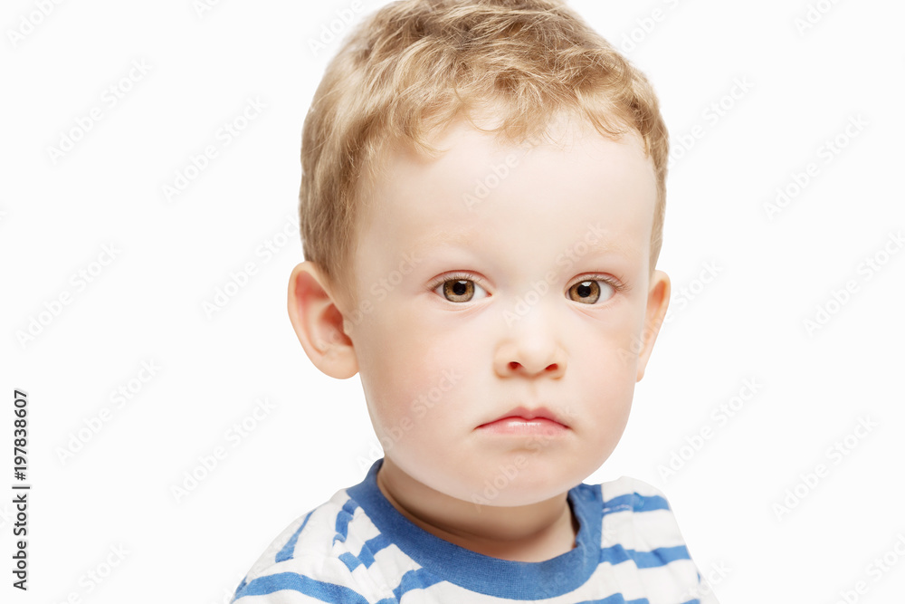 Serious little boy, close-up, isolated Serious little boy, close-up, isolated