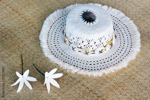 Cook Islander woman woven Rito Hat close up detail. Rito hats are worn by women to church. They are made from the uncurled immature fibre of the coconut palm and are of very high quality. photo