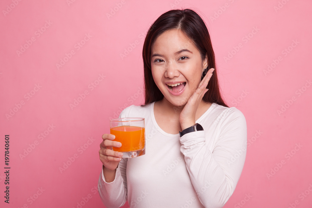 Happy Young Asian woman drink orange juice. Happy Young Asian woman drink orange juice.
