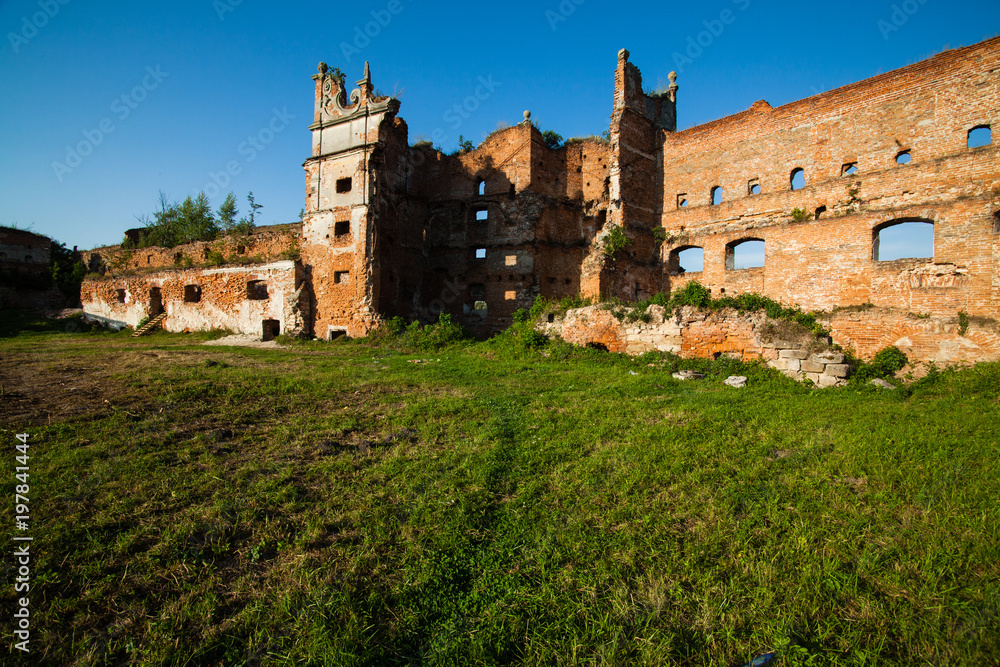 The old ruins of the collapsed walls with gates and windows Staroselskiy castle in Stare Selo, Lviv region, Ukraine