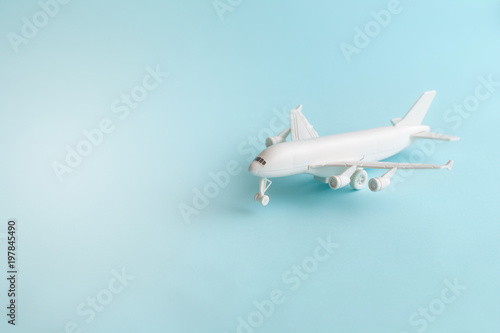 Plastic toy airplane on a Blue sky Background.