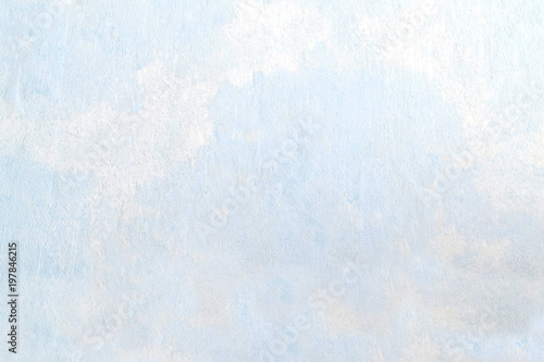 Abstract textured background on light blue putty photo