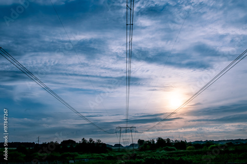 high-voltage line against the blue sky