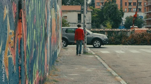 Wallpaper Mural Lonely boy turns around the corner of an empty street. Torontodigital.ca