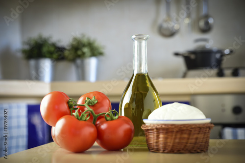 cherry tomatoes, mozzarella and olive oil, the main ingredients to make pizza margherita