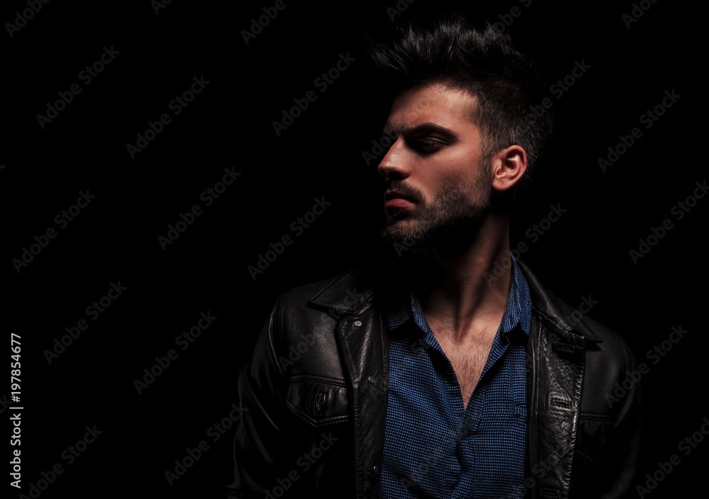 close up of fashion man looking to side close up of fashion man looking to side